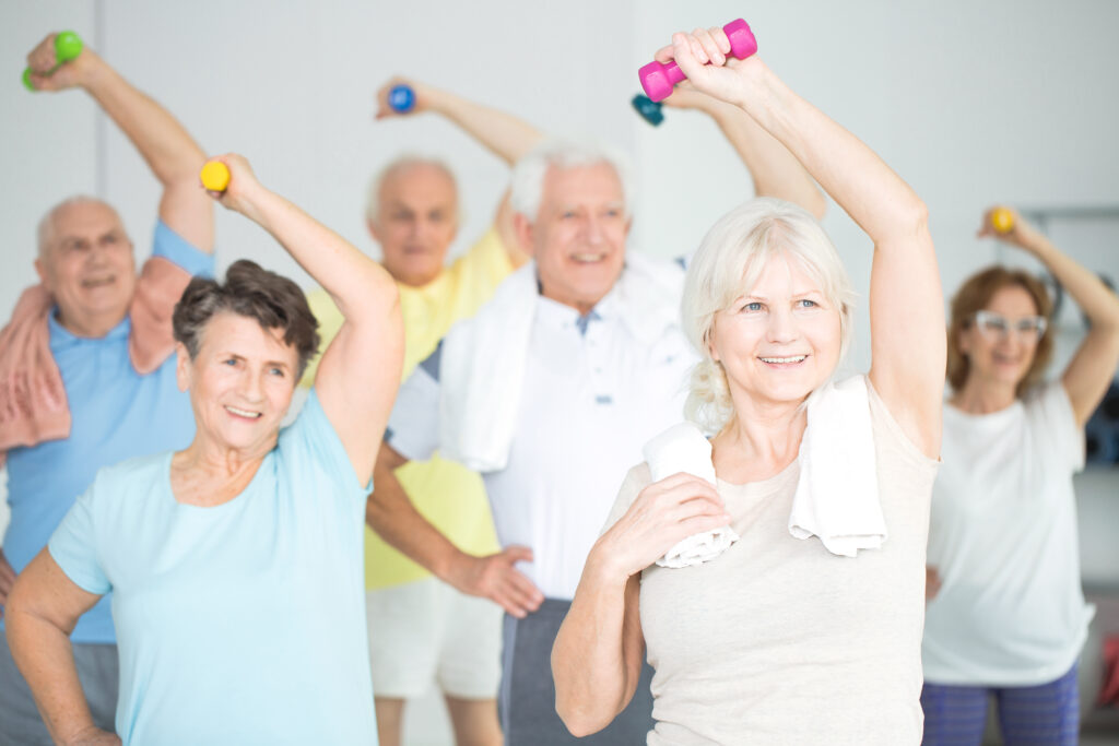 Seniors,Doing,Strength,Building,Fitness,Exercises,With,Dumbbells,,Holding,Their